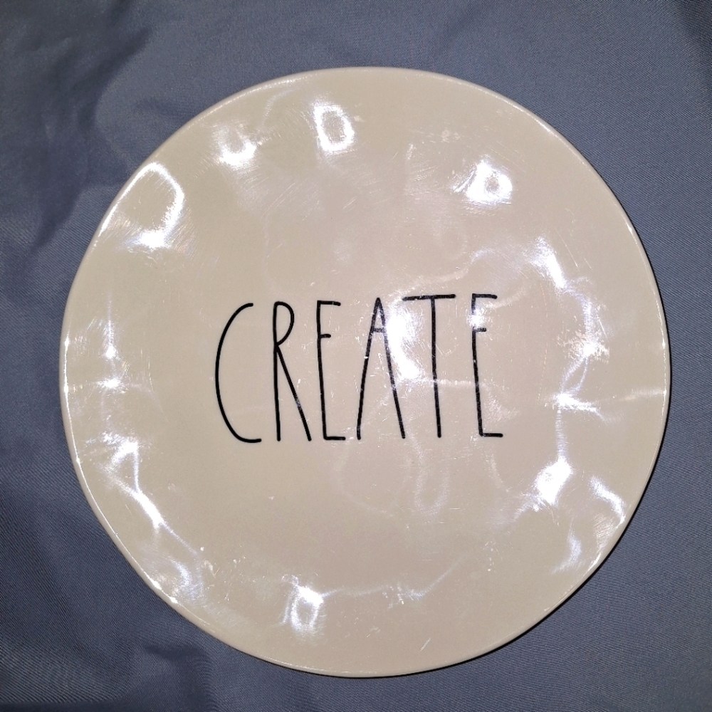A Rae Dunn plate with the word CREATE in the middle. It's 8" in diameter